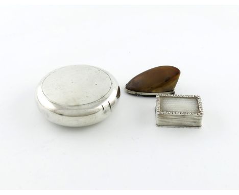 A late-Victorian silver 'squeeze-action' tobacco box, by Saunders and Shepherd, Birmingham 1898, plain circular form, plus a 