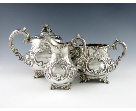 λA three-piece Victorian silver tea set, by Robert Harper, London 1858, baluster form, heavy foliate scroll decoration, scrol