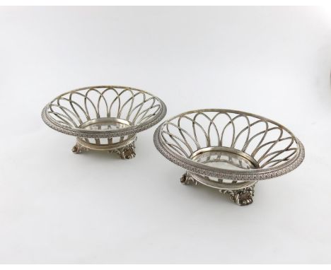 A pair of George IV silver baskets, by Robert Hennell, London 1827, tapering circular form, pierced wirework body, foliate bo