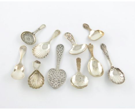 A collection of ten silver caddy spoons, comprising: one with a Trefid terminal, by Mappin and Webb, London 1912, one with an