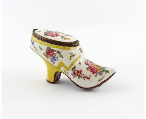 A Birmingham enamel snuff box, c.1760-70, modelled as a lady's shoe, brightly painted with polychrome sprays of flowers, the 