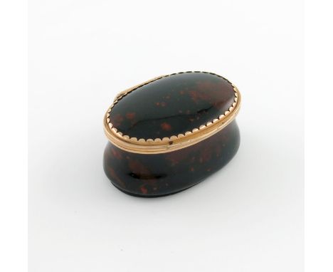 An 18th century gold-mounted bloodstone snuff box, unmarked, possibly English or North German, oval form, the reeded mount wi
