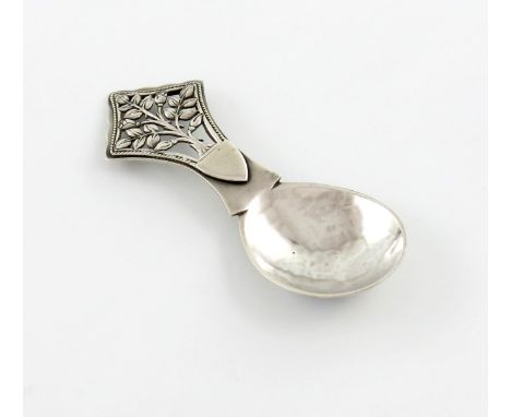 By H.G. Murphy, an Arts and Crafts silver Tree of Life caddy spoon, London 1929, also marked with the Falcon Mark, spot-hamme