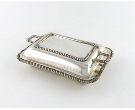 A silver entree dish and cover, by Elkington and Co, Birmingham 1920, rectangular form, gadroon border, the pull-off cover wi