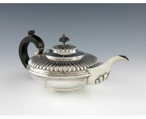 A William IV silver tea pot, by Charles Fox, London 1834, compressed circular form, part fluted decoration, fluted hinged cov