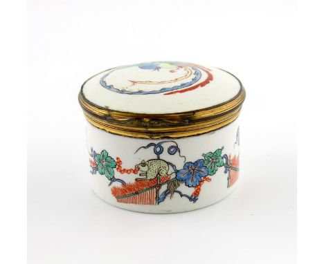 A Chantilly circular snuff box, c.1735, painted in the Kakiemon palette with the Squirrel and Vine pattern around the side, t