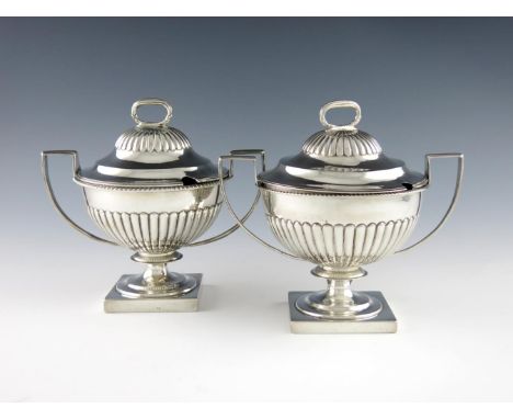 A matched pair of late-Victorian and Edwardian silver two-handled sauce tureens and covers, by Charles Stuart Harris, London 