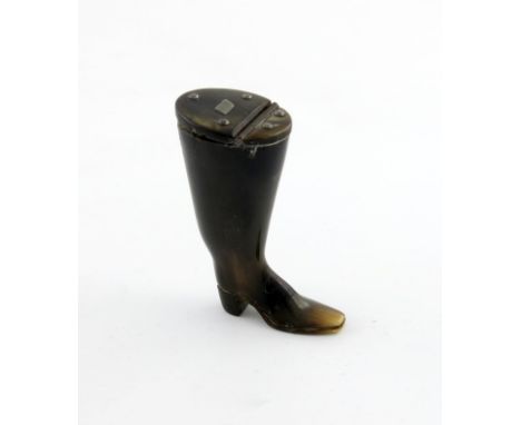 A Victorian novelty horn snuff box, modelled as a boot, the hinged cover with a base metal cartouche, height 7cm.