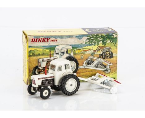 A Dinky Toys 325 David Brown Tractor With Disc Harrow, white body, brown chassis, red plastic exhaust, white wheels, white/re