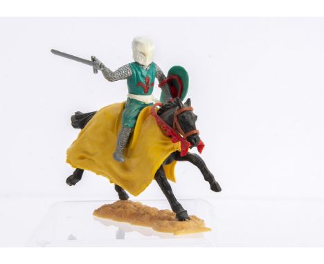 Timpo Toys rare mounted Medieval Knight in green with white helmet and belt,  with red fleur de lys on chest, and red lion on