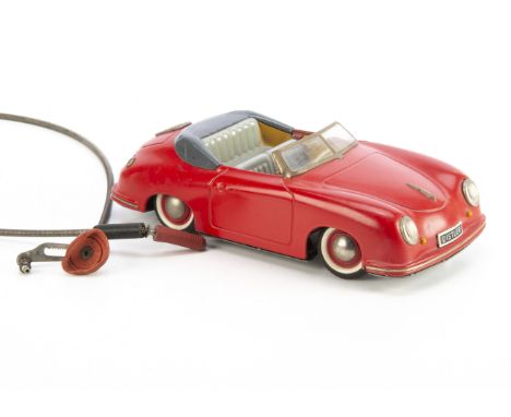 A Distler Tinplate Electro Matic 7500 Porsche 356, battery-operated model with red body, grey seats, dark grey tonneau, plate