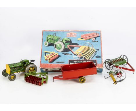 A Mettoy Tinplate Modern Farming Mechanical Tractor Set No.3262/0246, comprising clockwork Tractor, Hay Rake, Trailer with Ha