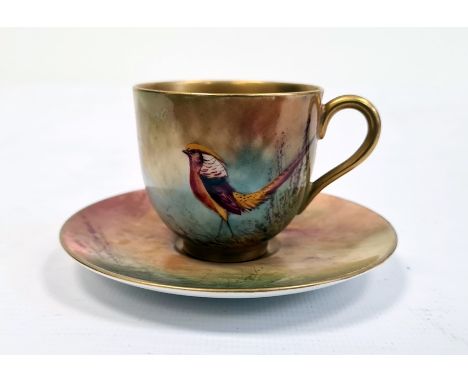 Royal Worcester demi tasse and saucer, printed puce marks, printed date code for 1929, painted by R. Austin with Asiatic phea