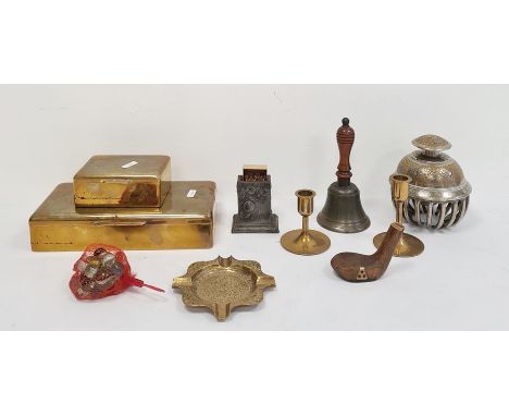 Two various brass cigarette boxes, an engraved elephant bell decorated with peacocks, a brass ashtray, brass candlesticks, a 