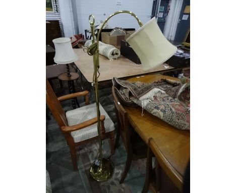 Modern brass floorstanding lamp with cream-coloured shade and four lampshades