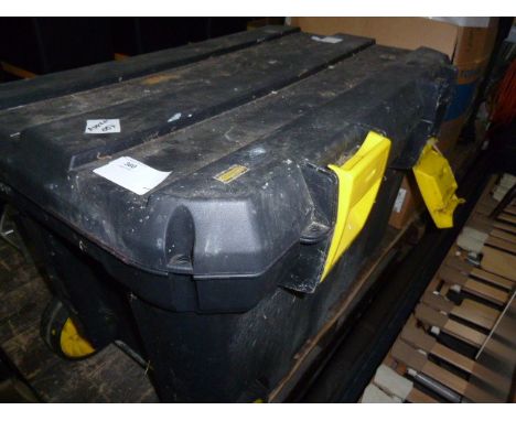 Large black and yellow  toolbox on wheels and four other double-decker tool boxes all with various contents of drills, screwd