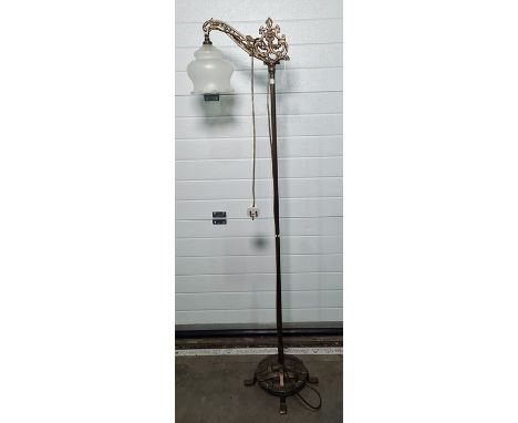 Brass floor standing light with opaque glass shade