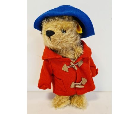 Steiff yellow label Paddington Bear, no. 661297 wearing blue felt hat, red duffel coat and fabric bag, with certificate no.48