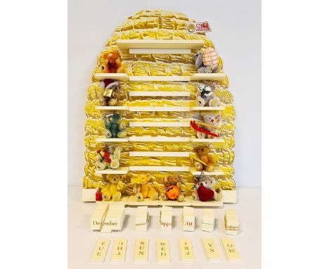 Steiff miniature collection for perpetual calendar, 12 miniature bears with wooden letters and numbers and beehive stand, no.