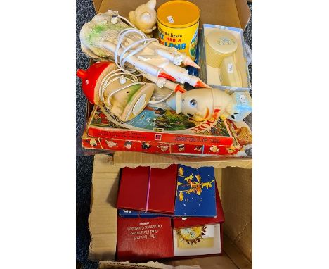 Two boxes of assorted items to include The Hummel Gold Christmas Ornament collection, Christmas tree decorations and a couple