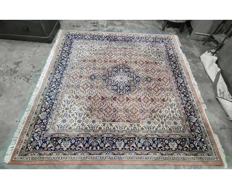 Chakhari Indo-Persian carpet, the central medallion with floral decoration, stepped foliate decorated border, in creams, gree