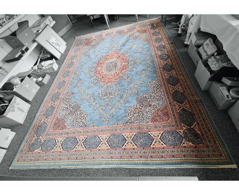 Persian rug, the central stepped foliate medallion on a light blue field, stepped foliate spandrels, multi-margin border, 358