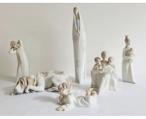 Five Lladro figures, painted and impressed marks, comprising a figure of the Madonna, 35cm high, a group of choirboys, a  che