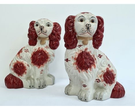 Pair Holkham pottery Staffordshire-type model spaniels with russet colouring, 32cm high (2) 