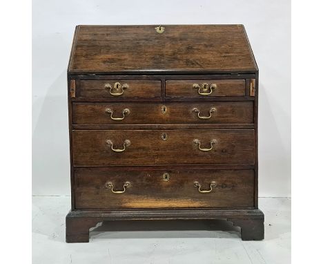 19th century oak bureau of four long graduated drawers, to bracket feet, 85.5cm x 104cm