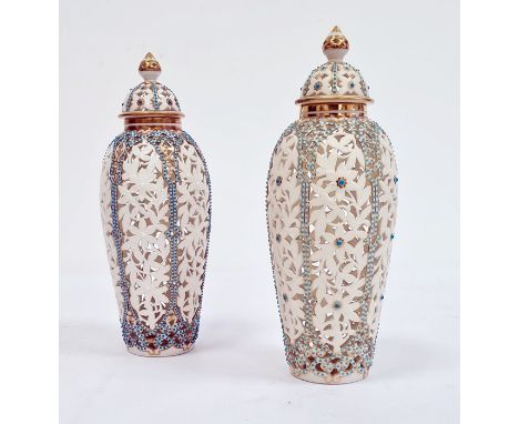 Pair of Worcester 'Grainger & Co' reticulated slender oviform Persian-style vases and domed covers, late 19th century, printe