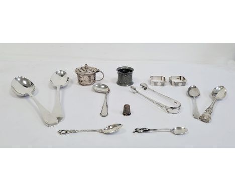Collection of silver items to include a pair of narrow napkin rings, a pair of tablespoons, a pair of sugar tongs, a mustard 
