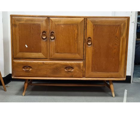 Light elm Ercol sideboard with three cupboard doors and single drawer, raised on turned beech supports, 114cm x 82cm Conditio