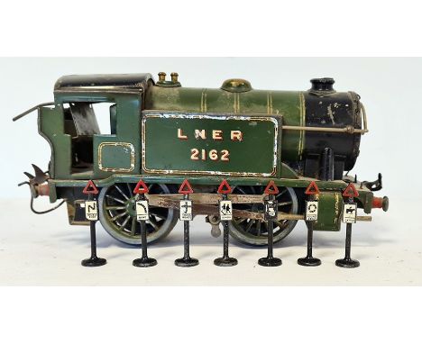 Hornby clockwork 0 gauge train marked LNER 2162 and a small quantity of vintage model train track signs