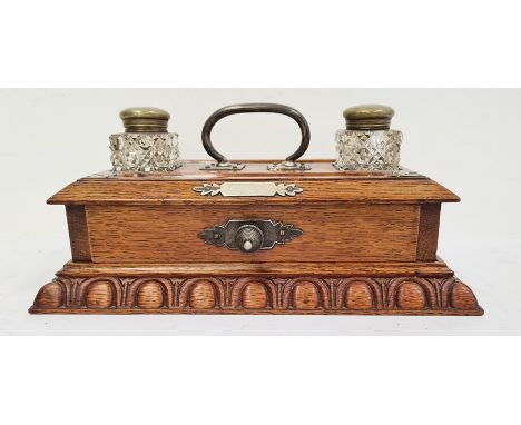 Late 19th century oak desktop inkwell with a pair of cut glass ink bottles with brass mounts and covers, comprising a drawer 