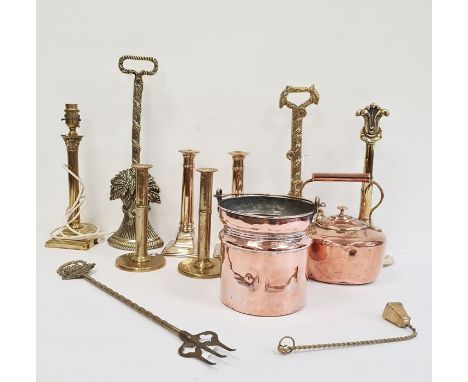 Various 19th century highly polished brass door stops, copper kettle, various brass candlesticks, a toasting fork and a brass