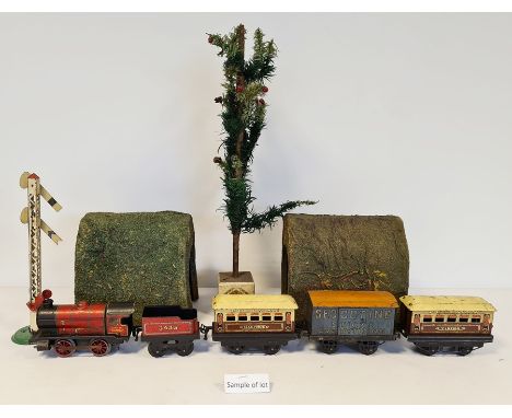 Quantity of '0' gauge clockwork trains to include Hornby engine, various carriages, track, etcCondition ReportSee attached im