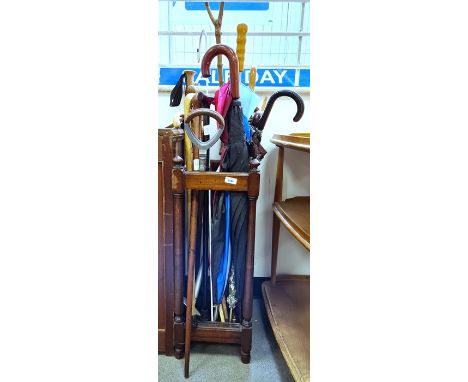 Stick umbrella stand and contents of various sticks, umbrellas and a shooting stick Condition Reportstand in fair condition, 