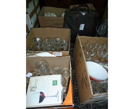 Large quantity of glassware including wines, fruit bowls, various ceramics and a Smiths Corona portable typewriter in a carry
