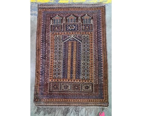 Persian rug, the brown ground with rich blue, cream and light brown decoration, approx 126cm x 88cm