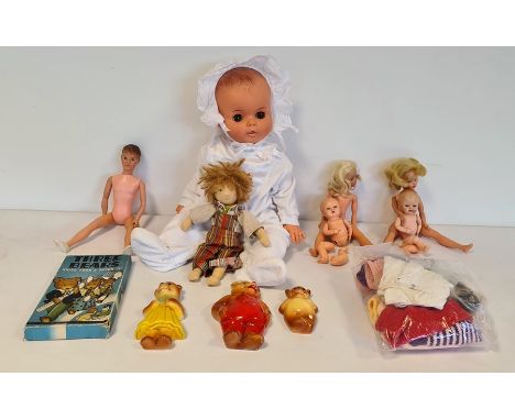 1960's/70's plastic doll, two Sindy dolls, a Paul doll, Sindy and Paul clothes, a Waldorf fabric doll, Three Bears knife, for