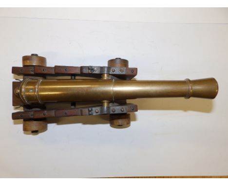 A miniature bronze cannon, 12” overall.