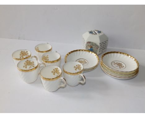 Six Minton 'Gold Rose' coffee cups and saucers together with a Wedgwood Peter Rabbit money box. (13)