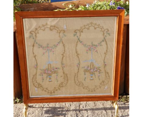 An art noveau rectangular firescreen with brass handle and feet.