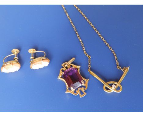 A yellow metal knot pendant on chain, one other and a pair of cameo earrings. (4)