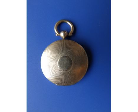 A Victorian gold engine turned locket set with daguerrotype male portrait.