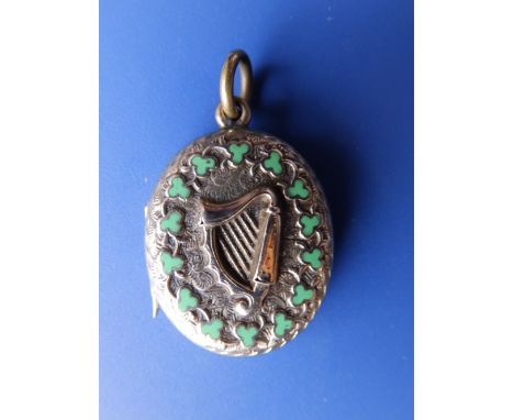 A Victorian  Irish yellow metal harp locket with thermometer inside.