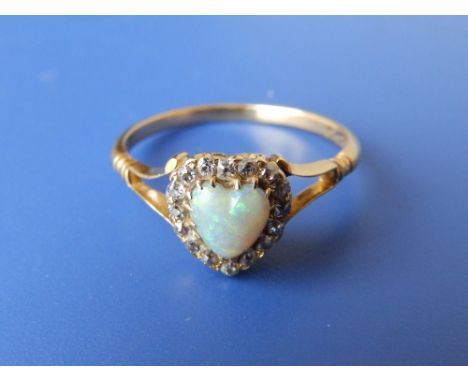 A heart shaped opal &amp; diamond 18ct gold cluster ring.