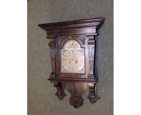 A 19thC bracket style wall clock with brass dial.