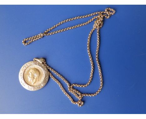 A 1911 half sovereign in mount on chain.