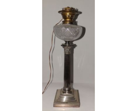 A Victorian EP corinthian column oil lamp with cut glass reservoir on square pedestal base – Hink & Sons patent, 22” overall